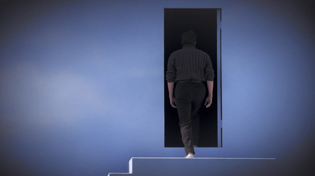 Truman show lessons, Truman show moral lesson, image of Truman walking through black door at top of stairs.